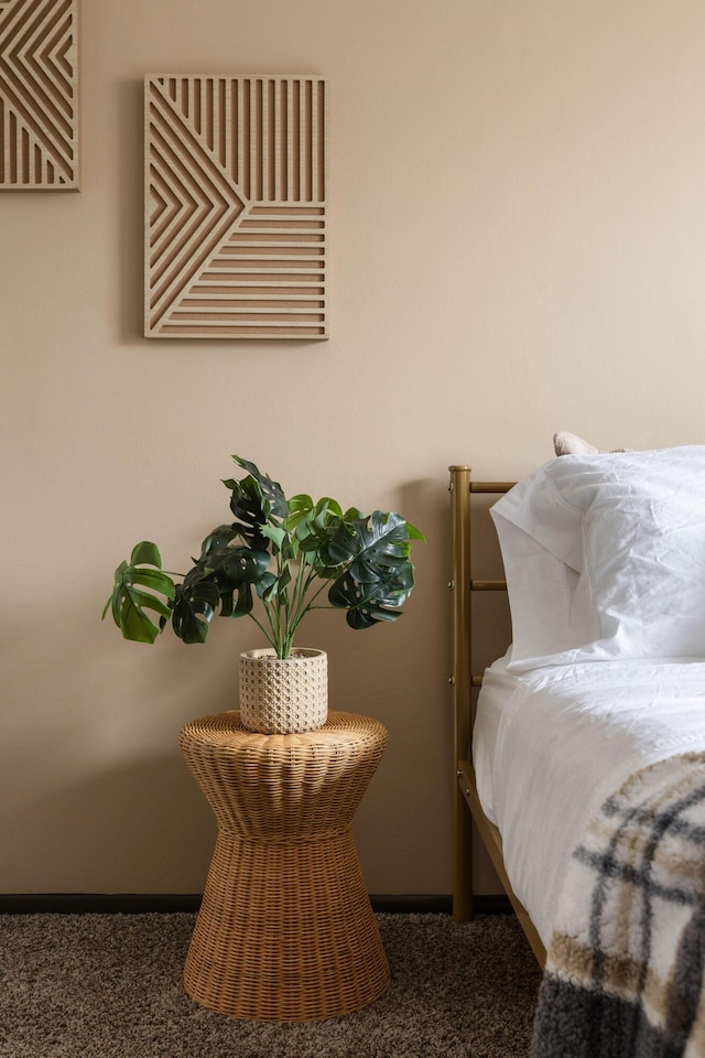 bedroom with carpet flooring and baseboards