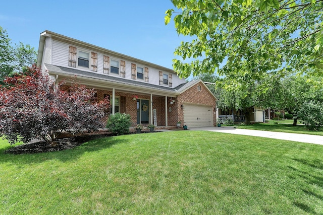 113 Bridgeport Way, Delaware, OH 43015 - view of front of house with driveway, a front yard, an attached garage, and brick siding
