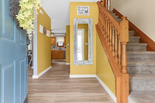 113 Bridgeport Way, Delaware, OH 43015 - entryway with stairway and light wood finished floors