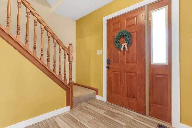 113 Bridgeport Way, Delaware, OH 43015 - foyer featuring stairway and light wood-style floors