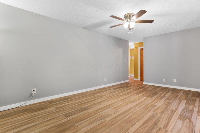 113 Bridgeport Way, Delaware, OH 43015 - empty room featuring light wood finished floors, ceiling fan, and a textured ceiling