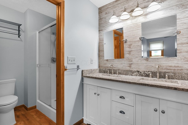 113 Bridgeport Way, Delaware, OH 43015 - bathroom featuring a stall shower, double vanity, and wood finished floors