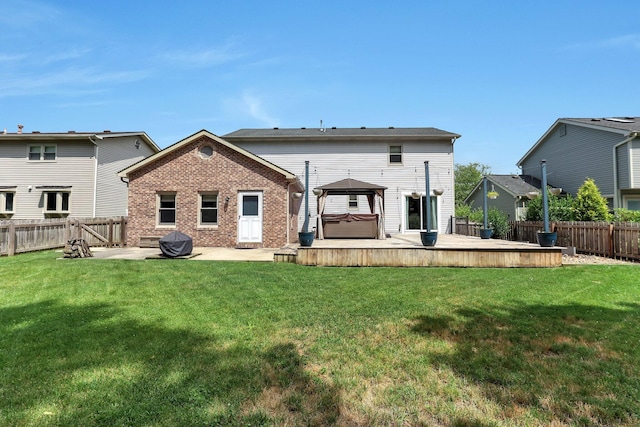 113 Bridgeport Way, Delaware, OH 43015 - back of house featuring a hot tub, a fenced backyard, a patio, a deck, and brick siding