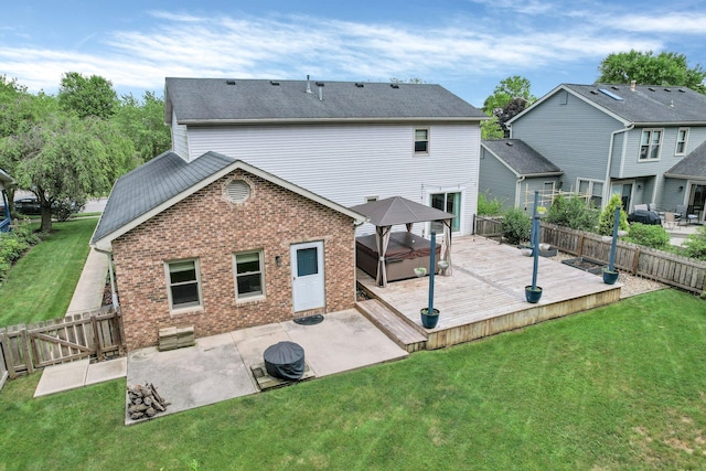 113 Bridgeport Way, Delaware, OH 43015 - rear view of house with a gazebo, a hot tub, brick siding, a patio, and a wooden deck