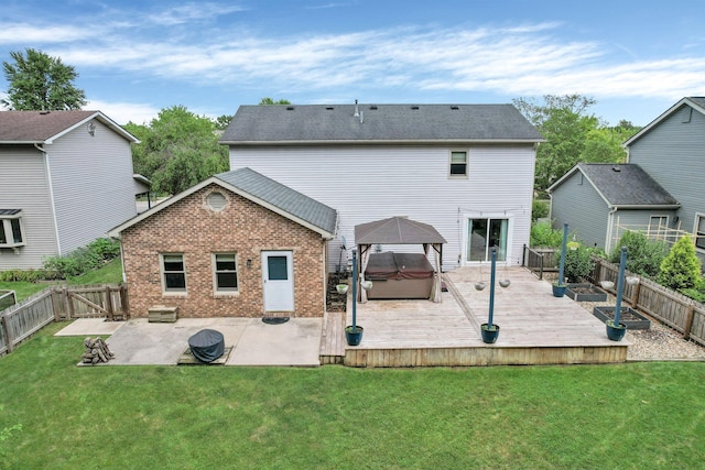 113 Bridgeport Way, Delaware, OH 43015 - back of property featuring a hot tub, a gazebo, a fenced backyard, a wooden deck, and a patio