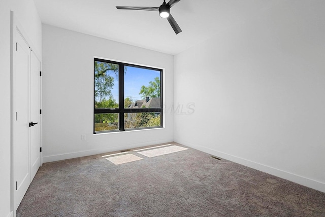 1106 Oak St Unit 12, Columbus, OH 43205 - unfurnished bedroom with carpet, baseboards, and a ceiling fan