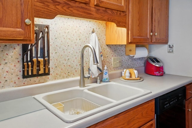 415 Yencer St, Baltimore, OH 43105 - kitchen featuring black dishwasher, a sink, wallpapered walls, brown cabinetry, and light countertops