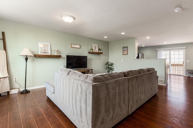 5958 Central College Rd, New Albany, OH 43054 - living room with dark wood finished floors, recessed lighting, a textured ceiling, and baseboards