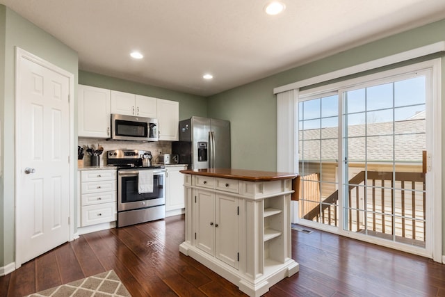 5958 Central College Rd, New Albany, OH 43054 - kitchen with appliances with stainless steel finishes, white cabinets, open shelves, backsplash, and recessed lighting