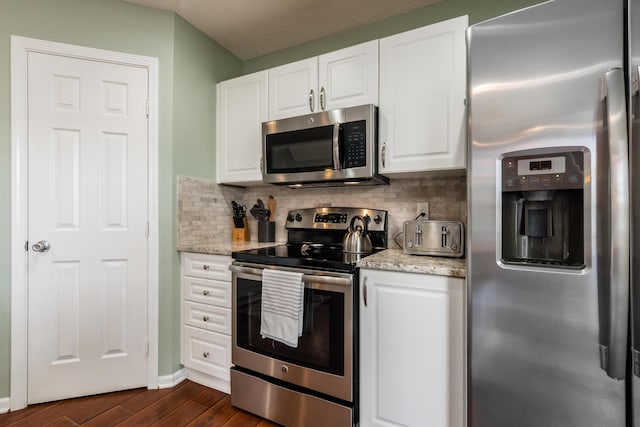 5958 Central College Rd, New Albany, OH 43054 - kitchen with appliances with stainless steel finishes, dark wood-style floors, white cabinetry, and backsplash