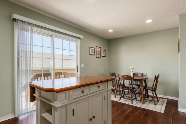 5958 Central College Rd, New Albany, OH 43054 - kitchen with dark wood-type flooring, baseboards, white cabinetry, recessed lighting, and a kitchen island