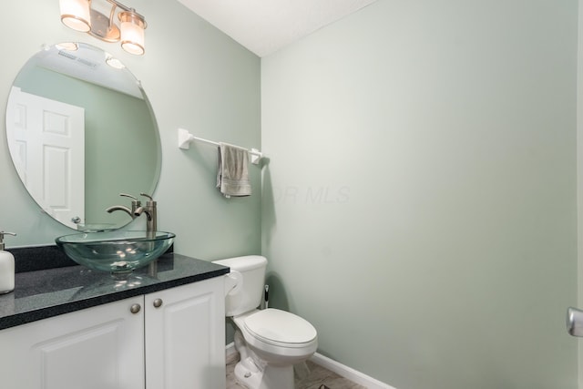 5958 Central College Rd, New Albany, OH 43054 - half bathroom featuring toilet, vanity, and baseboards
