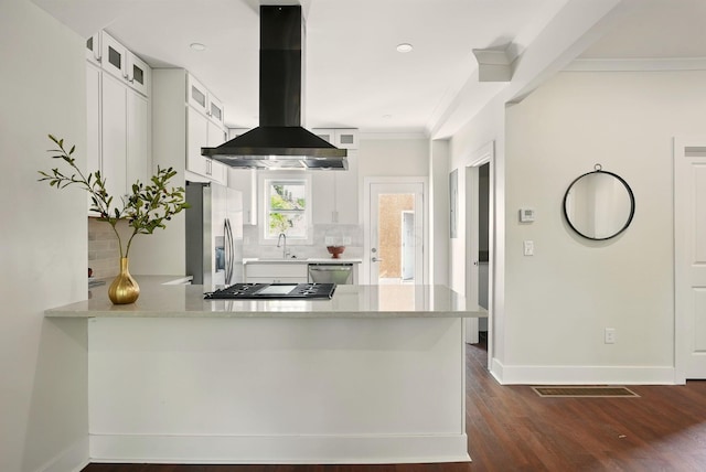 436 W 2nd Ave, Columbus, OH 43201 - kitchen with island exhaust hood, appliances with stainless steel finishes, decorative backsplash, baseboards, and ornamental molding