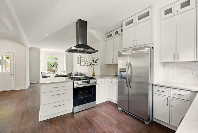 436 W 2nd Ave, Columbus, OH 43201 - kitchen featuring appliances with stainless steel finishes, wall chimney range hood, a peninsula, light countertops, and dark wood finished floors