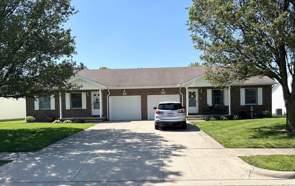 1950 Beacon St, Washington Court House, OH 43160 - single story home with a garage, a front yard, concrete driveway, and brick siding