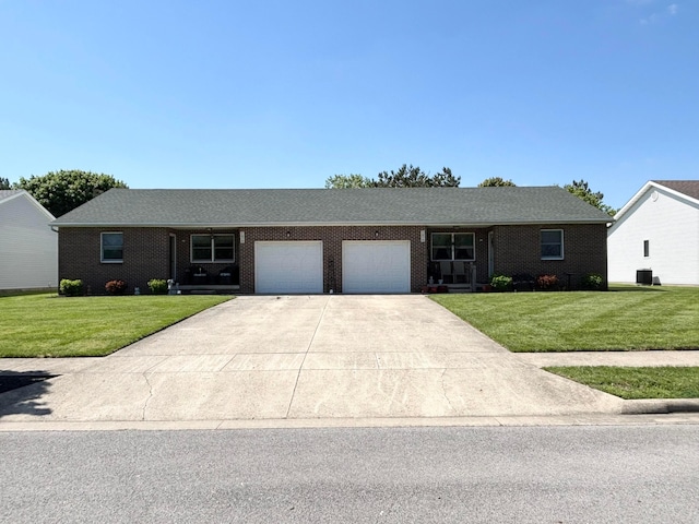 1950 Beacon St, Washington Court House, OH 43160 - single story home featuring a garage, a front yard, driveway, and brick siding