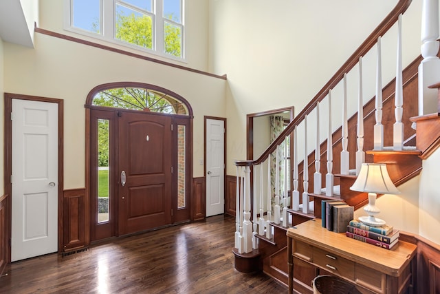 5098 Cascade Dr, Powell, OH 43065 - entrance foyer with a towering ceiling, plenty of natural light, dark wood finished floors, and stairs