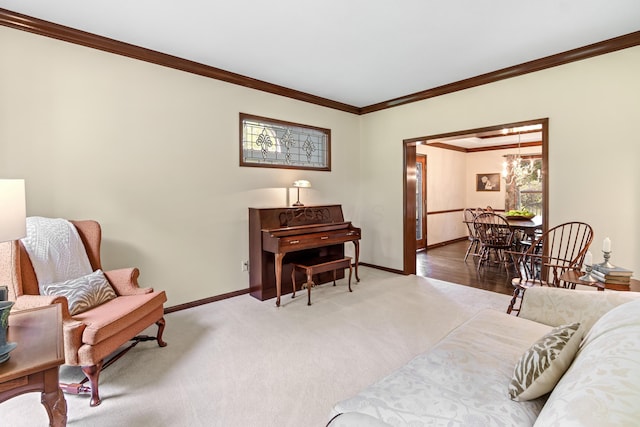 5098 Cascade Dr, Powell, OH 43065 - living area featuring baseboards, ornamental molding, carpet flooring, and a chandelier