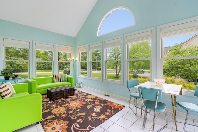 5098 Cascade Dr, Powell, OH 43065 - sunroom featuring tile patterned flooring, high vaulted ceiling, and baseboards