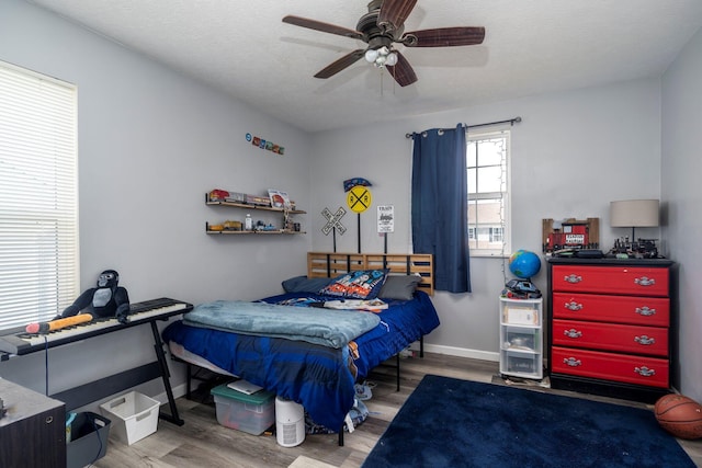 447 Wingate Pl, Mount Sterling, OH 43143 - bedroom with wood finished floors, baseboards, and ceiling fan