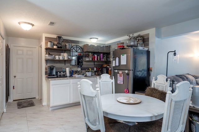 447 Wingate Pl, Mount Sterling, OH 43143 - dining room with bar with sink and light marble finish floors