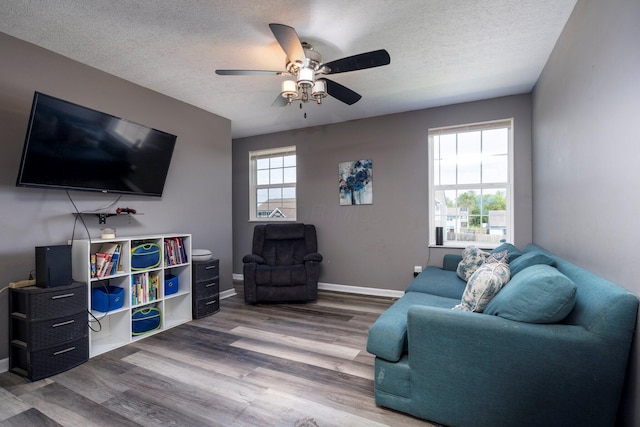447 Wingate Pl, Mount Sterling, OH 43143 - living room with ceiling fan, wood finished floors, a textured ceiling, and baseboards