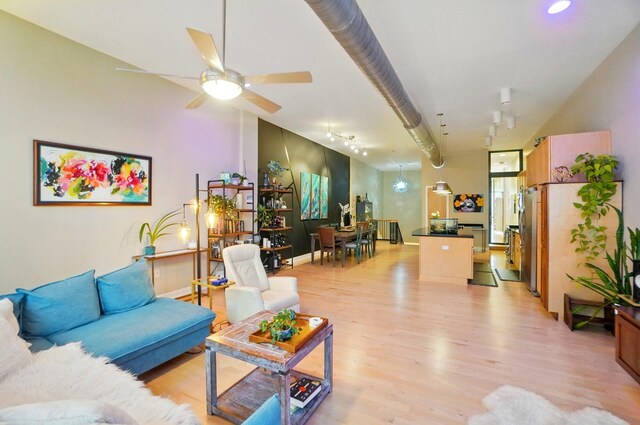 300 W Spring St Unit 515, Columbus, OH 43215 - living room with light wood-style floors and ceiling fan