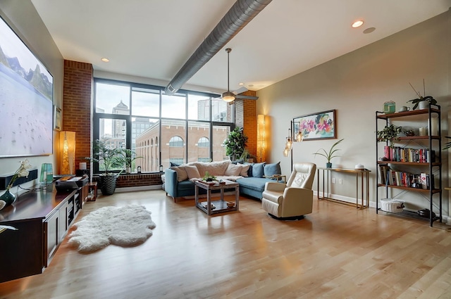 300 W Spring St Unit 515, Columbus, OH 43215 - living room with light wood-style floors, recessed lighting, and baseboards