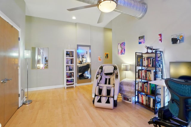 300 W Spring St Unit 515, Columbus, OH 43215 - living area with wood finished floors, ceiling fan, and baseboards