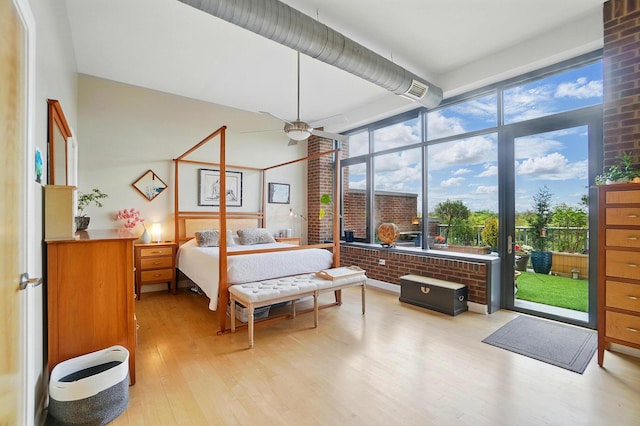 300 W Spring St Unit 515, Columbus, OH 43215 - bedroom with light wood-type flooring and access to exterior