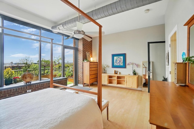 300 W Spring St Unit 515, Columbus, OH 43215 - bedroom with light wood-style floors and ceiling fan