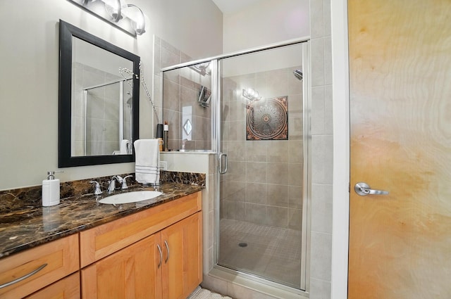 300 W Spring St Unit 515, Columbus, OH 43215 - bathroom featuring vanity and a shower stall