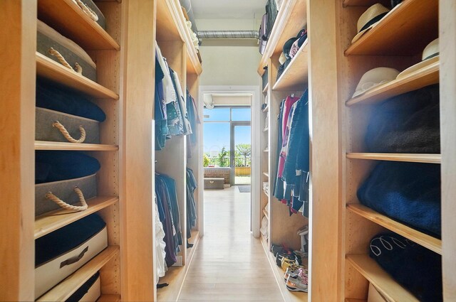 300 W Spring St Unit 515, Columbus, OH 43215 - walk in closet featuring wood finished floors