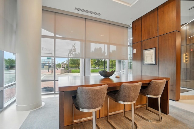 300 W Spring St Unit 515, Columbus, OH 43215 - dining area featuring a wall of windows and a high ceiling
