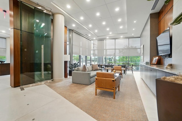 300 W Spring St Unit 515, Columbus, OH 43215 - living area featuring a high ceiling, recessed lighting, and a wall of windows
