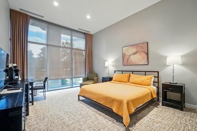 300 W Spring St Unit 515, Columbus, OH 43215 - bedroom featuring floor to ceiling windows, multiple windows, recessed lighting, and baseboards