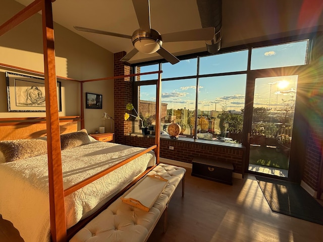 300 W Spring St Unit 515, Columbus, OH 43215 - bedroom featuring wood finished floors, high vaulted ceiling, and expansive windows
