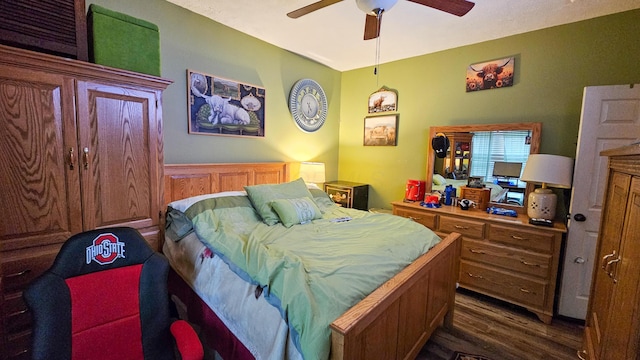 5353 Buckeye Valley Rd NE, New Lexington, OH 43764 - bedroom featuring dark wood-type flooring and a ceiling fan