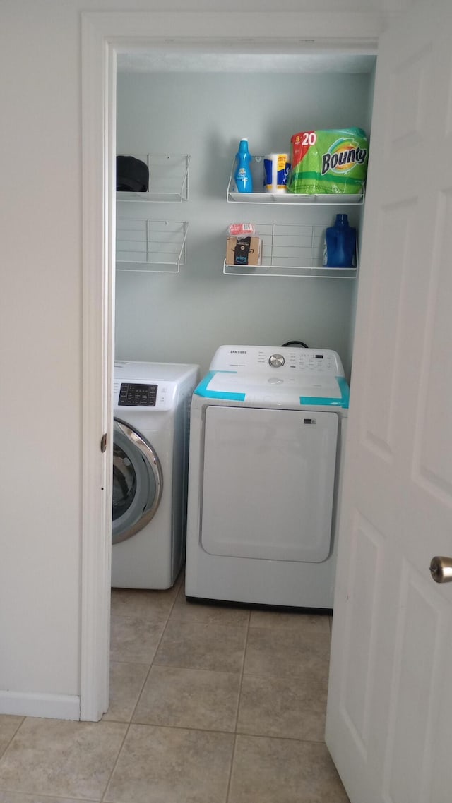 5888 Abernathy Ln Unit 5888A, Columbus, OH 43232 - washroom with independent washer and dryer and light tile patterned floors