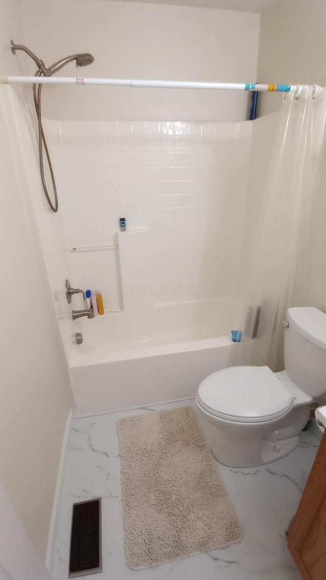 5888 Abernathy Ln Unit 5888A, Columbus, OH 43232 - full bathroom with marble finish floors, toilet, and shower / bath combo with shower curtain
