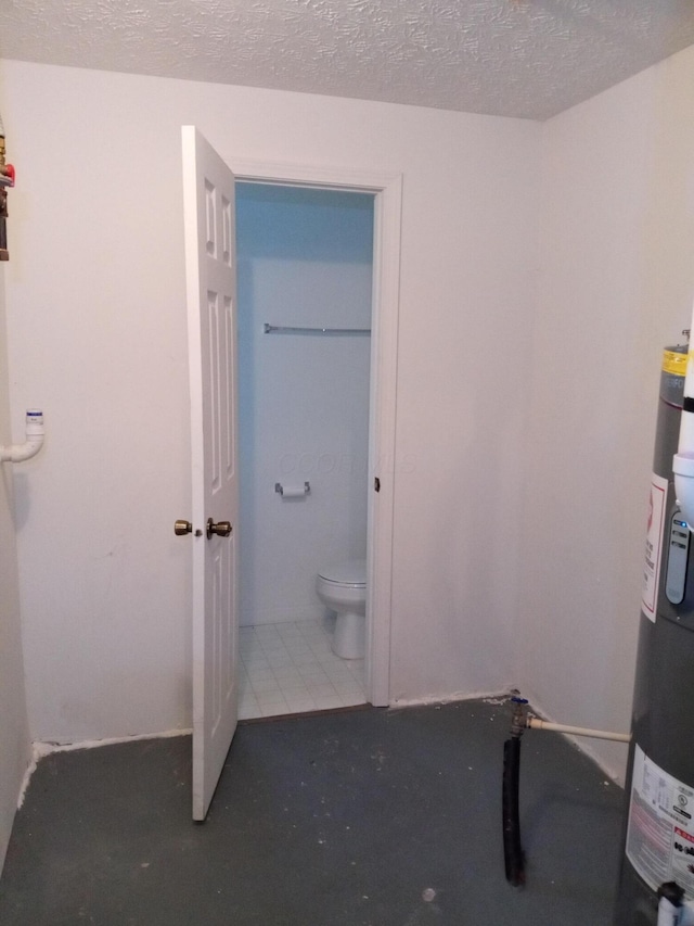 5888 Abernathy Ln Unit 5888A, Columbus, OH 43232 - bathroom with toilet, water heater, and a textured ceiling