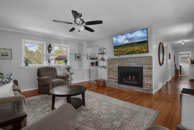 6641 Charles Rd, Westerville, OH 43082 - living room featuring baseboards, wood finished floors, a brick fireplace, and ceiling fan