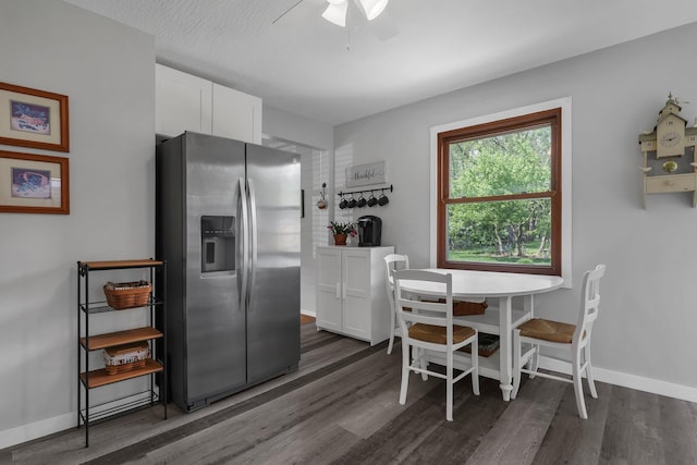 6641 Charles Rd, Westerville, OH 43082 - dining room with dark wood-type flooring, a ceiling fan, and baseboards