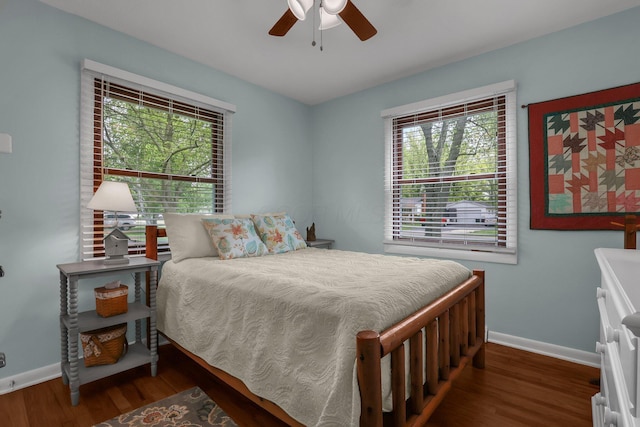 6641 Charles Rd, Westerville, OH 43082 - bedroom with baseboards, multiple windows, and wood finished floors