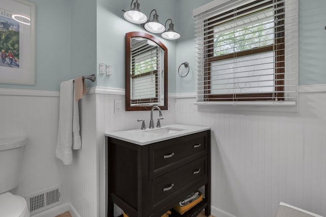 6641 Charles Rd, Westerville, OH 43082 - bathroom with a wainscoted wall, toilet, and vanity
