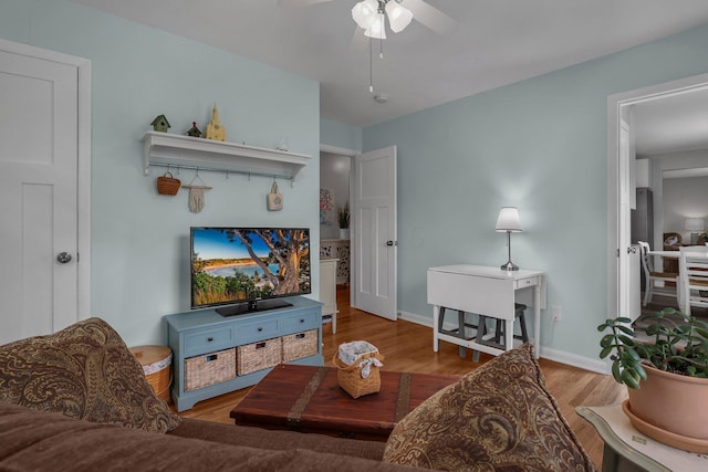 6641 Charles Rd, Westerville, OH 43082 - living area featuring ceiling fan, wood finished floors, and baseboards