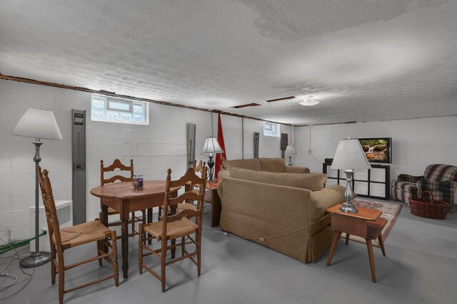 6641 Charles Rd, Westerville, OH 43082 - living room featuring a textured ceiling and concrete flooring