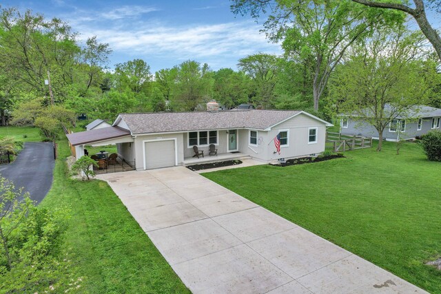 6641 Charles Rd, Westerville, OH 43082 - ranch-style home featuring driveway, a garage, a porch, and stucco siding