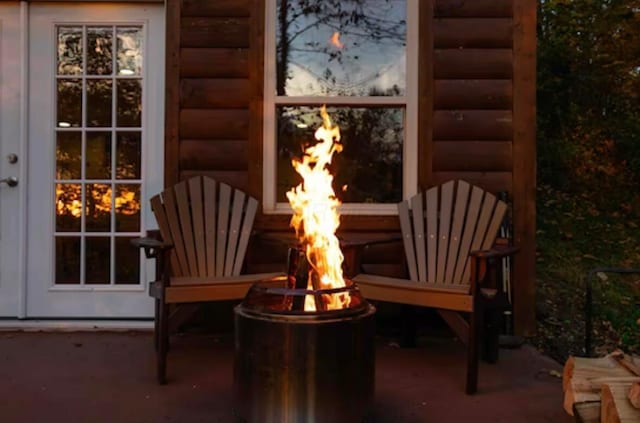 820 Pump Station Rd SE, Sugar Grove, OH 43155 - view of patio / terrace featuring a lit fireplace and an outdoor fire pit