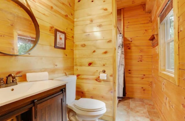 820 Pump Station Rd SE, Sugar Grove, OH 43155 - bathroom with wood walls, toilet, and vanity